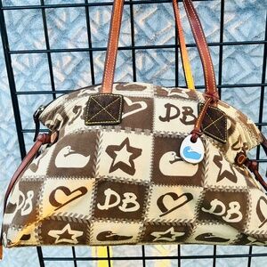 Dooney and Bourke monogram bag. Brown tan beige Shoulder. Hot pink interior.